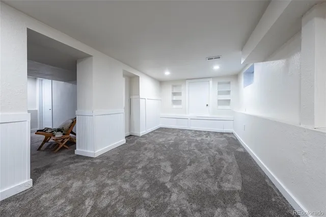 a view of a livingroom with closet and a window
