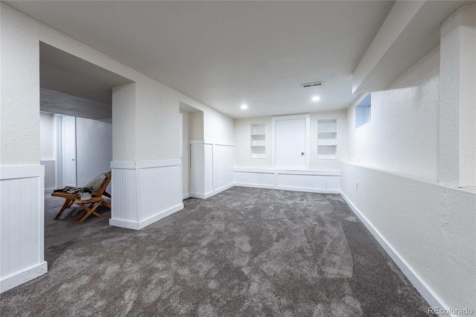 1367 Monroe Street Denver, CO 80206 - Photo 34 of 48 a view of a livingroom with closet and a window
