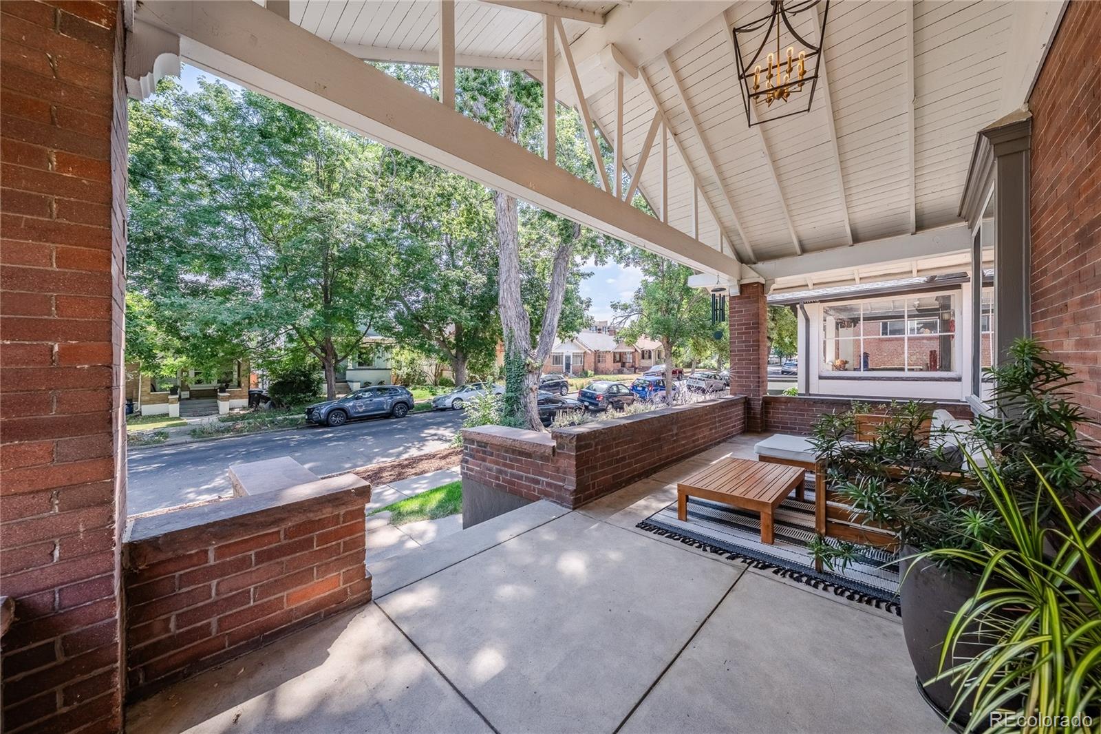1367 Monroe Street Denver, CO 80206 - Photo 44 of 48 a outdoor space with lots of potted plants