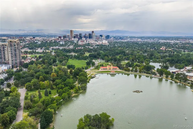 an aerial view of residential building and lake