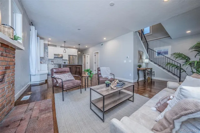 a living room with furniture and a rug