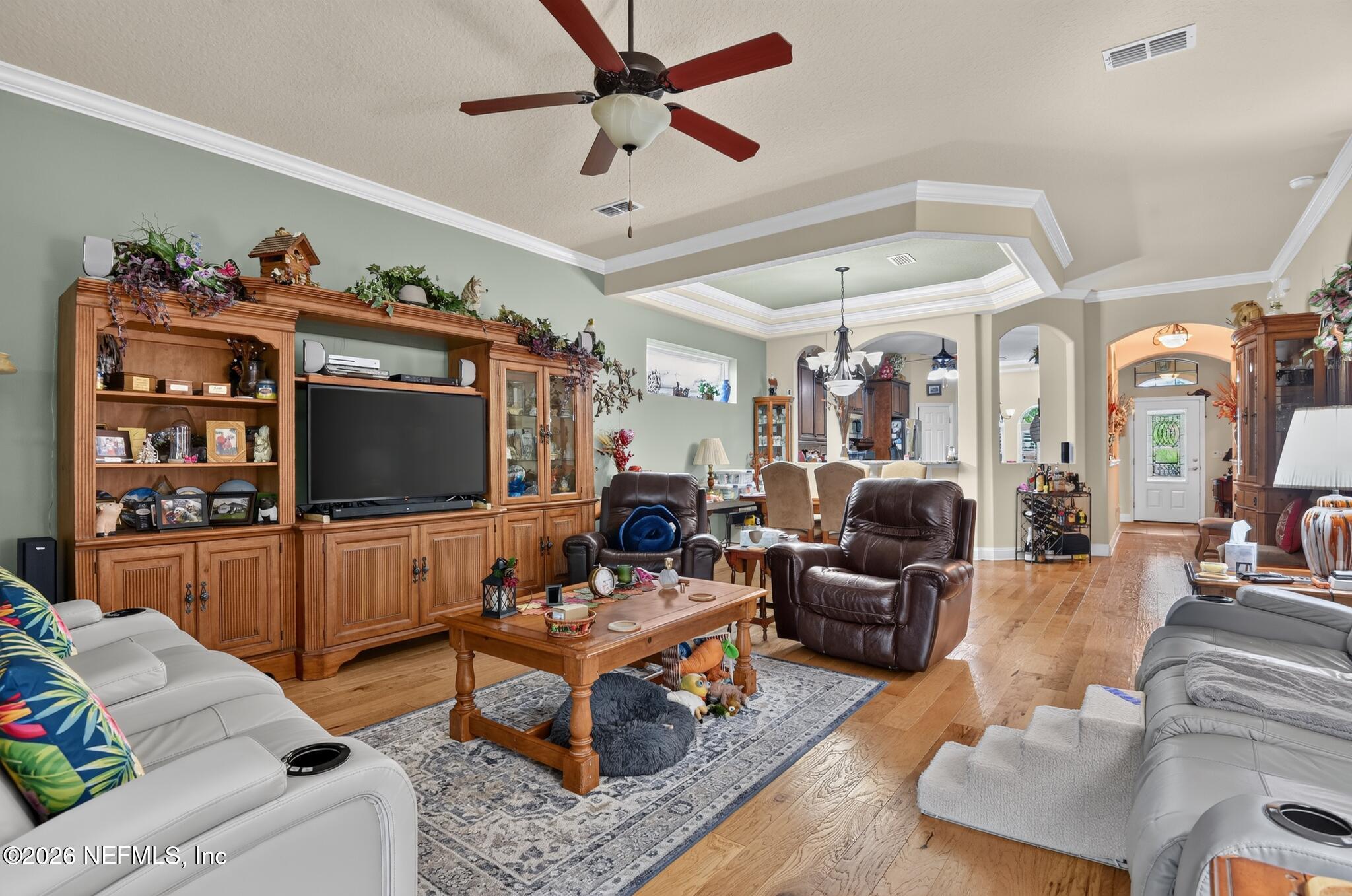 110 Vía Roma Ormond Beach, FL 32174 - Photo 9 of 43 a living room with furniture and a flat screen tv