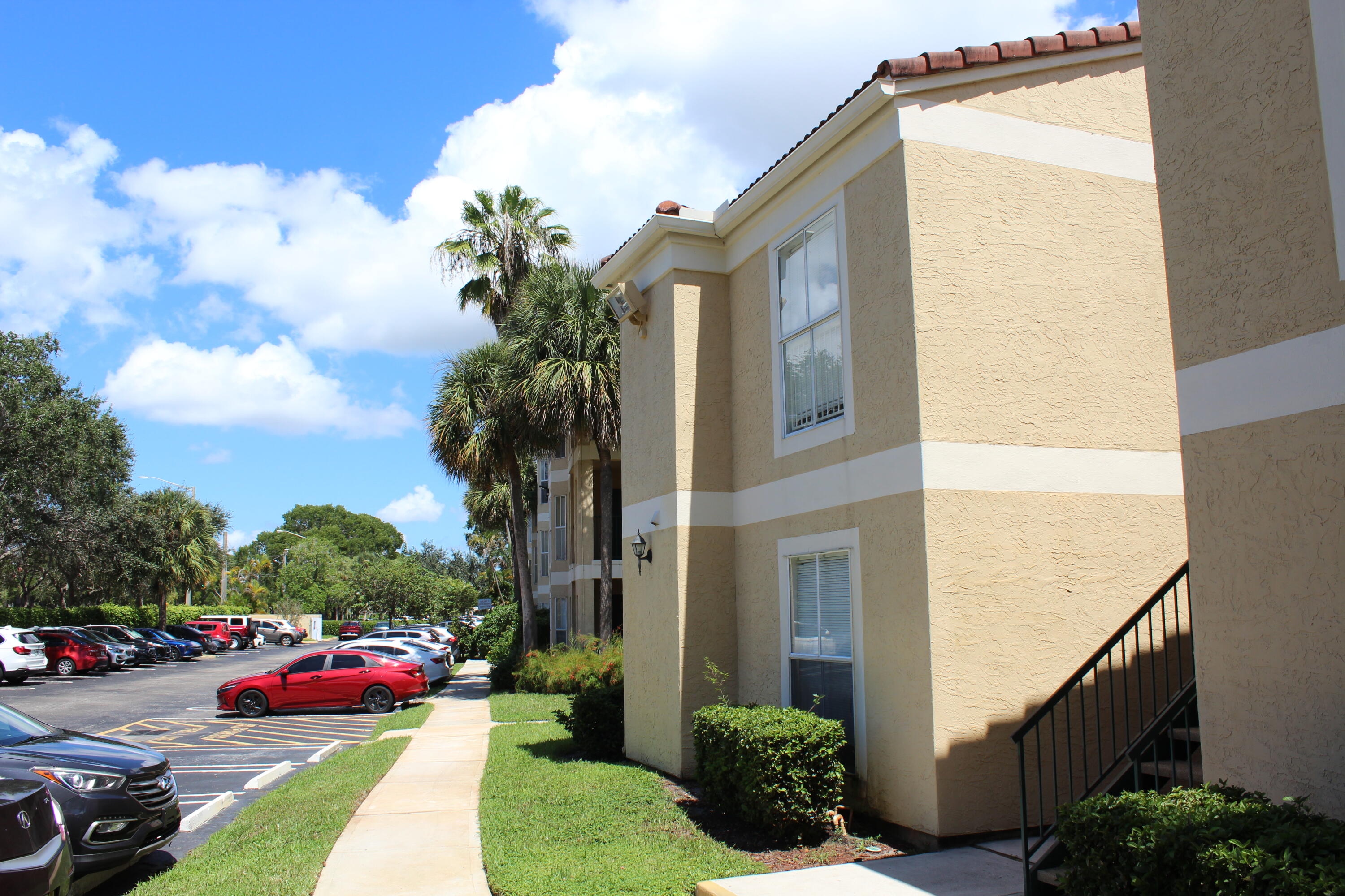 899 Riverside Drive, Unit 620 Coral Springs, FL 33071 - Photo 42 of 46 a front view of a house with a yard