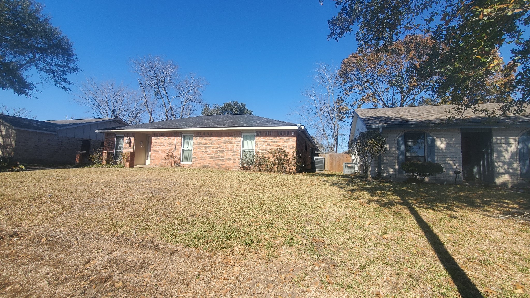 15414 West Hampton Circle Houston, TX 77071 - Photo 2 of 30 a front view of a house with a yard and garage