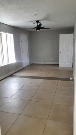 a view of an empty room with a window