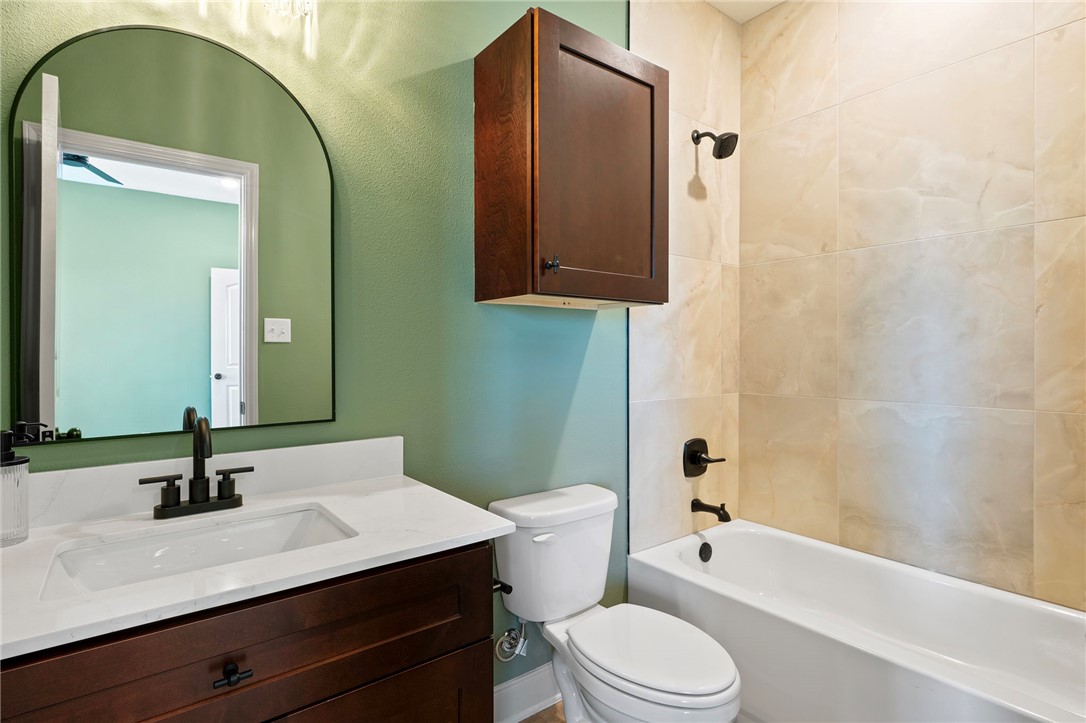 102 33rd Street West Bryan, TX 77803 - Photo 12 of 22 a bathroom with a sink a toilet and bathtub