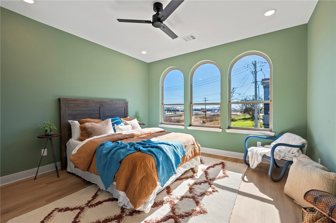 102 33rd Street West Bryan, TX 77803 - Photo 13 of 22 a bedroom with a bed and ceiling windows