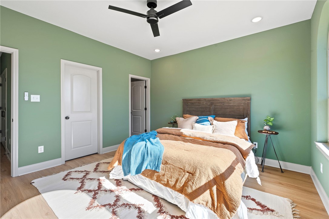 102 33rd Street West Bryan, TX 77803 - Photo 14 of 22 a bedroom with a bed and a dresser