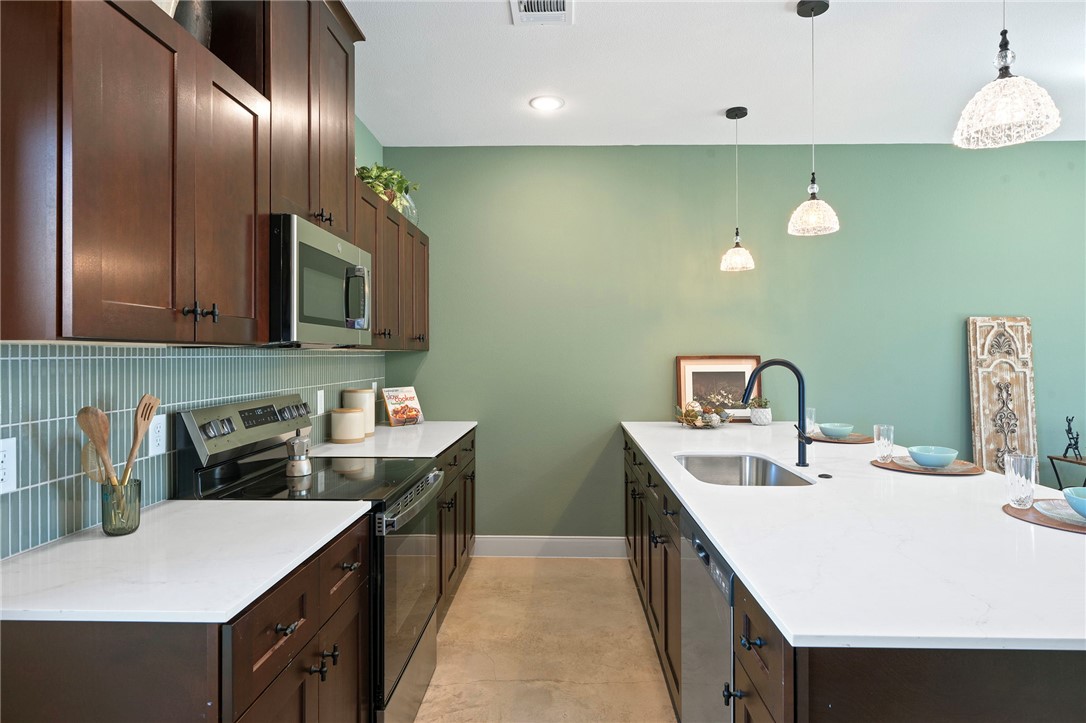 102 33rd Street West Bryan, TX 77803 - Photo 2 of 22 a kitchen that has a sink and a stove