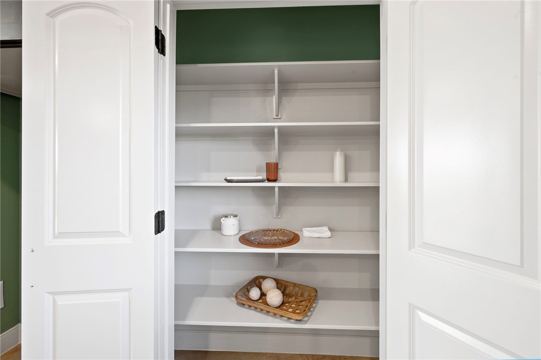 102 33rd Street West Bryan, TX 77803 - Photo 6 of 22 a shelf with cup and plates