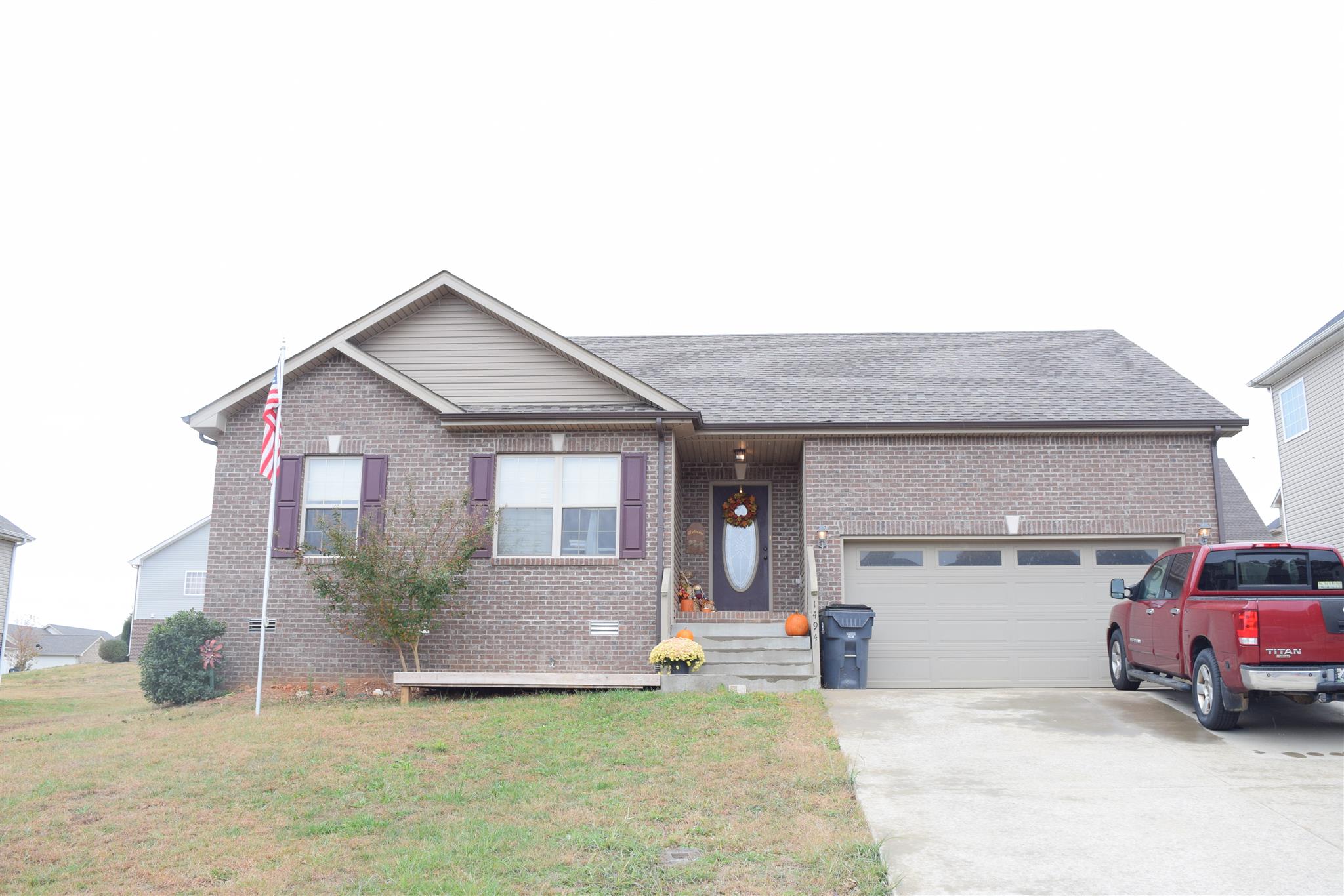 1494 Raven Road Clarksville, TN 37042 - Photo 1 of 25 a car parked in front of garage