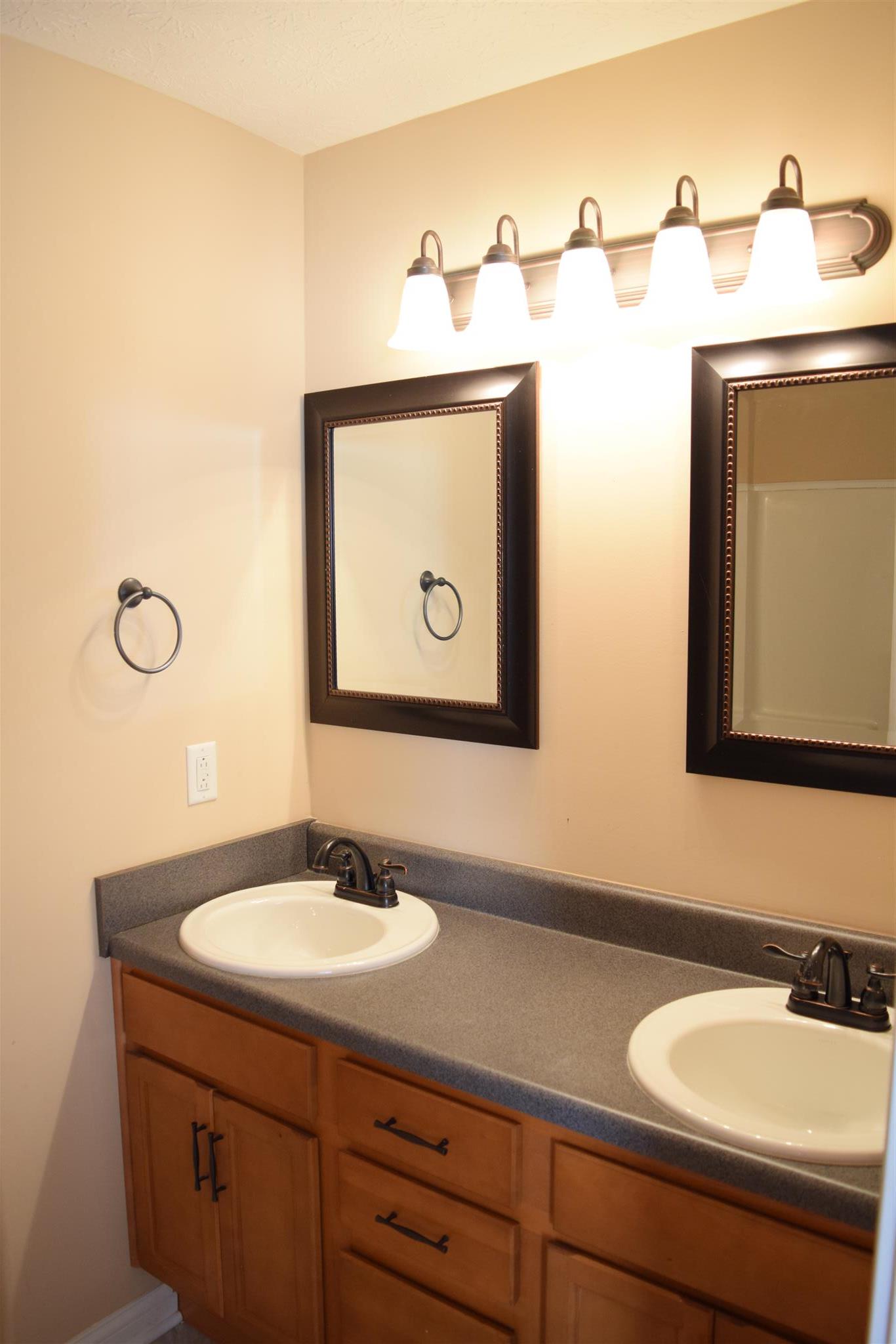 1494 Raven Road Clarksville, TN 37042 - Photo 14 of 25 a bathroom with a sink and a mirror