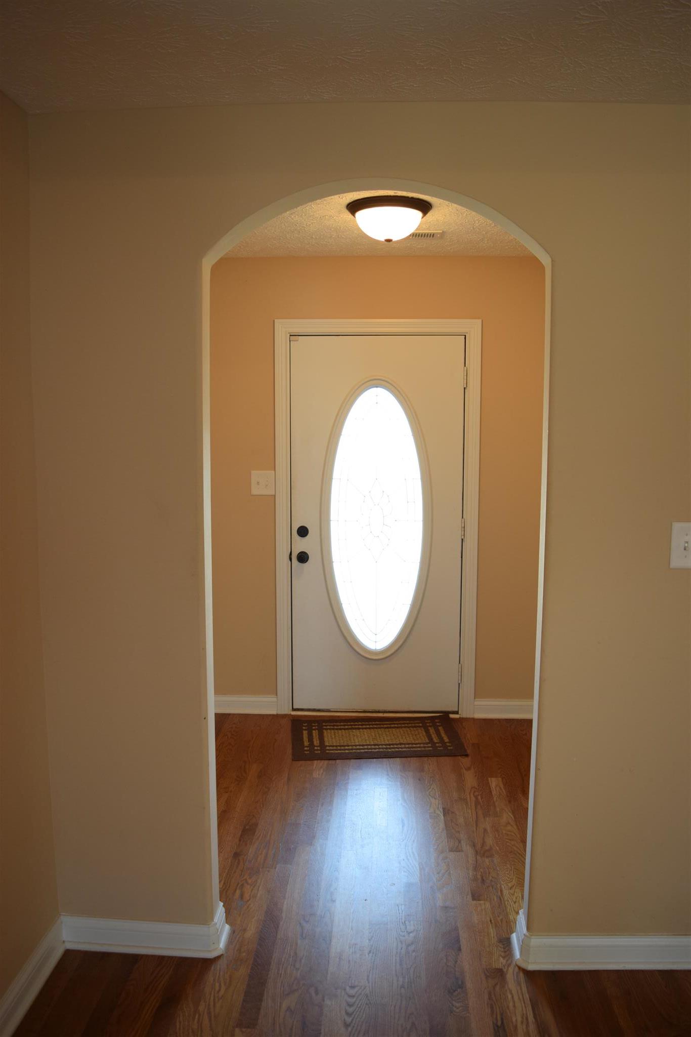 1494 Raven Road Clarksville, TN 37042 - Photo 3 of 25 a view of a room with wooden floor and a window