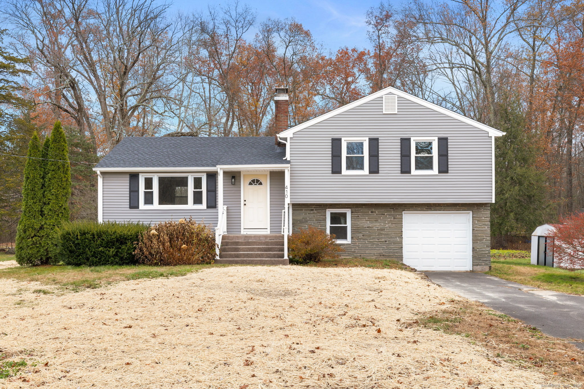 410 South Stone Street Suffield, CT 06093 - Photo 1 of 23 a front view of a house with a yard
