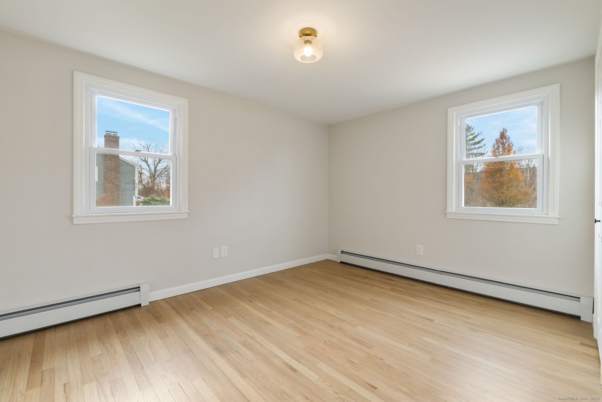 410 South Stone Street Suffield, CT 06093 - Photo 18 of 23 a view of an empty room with a window