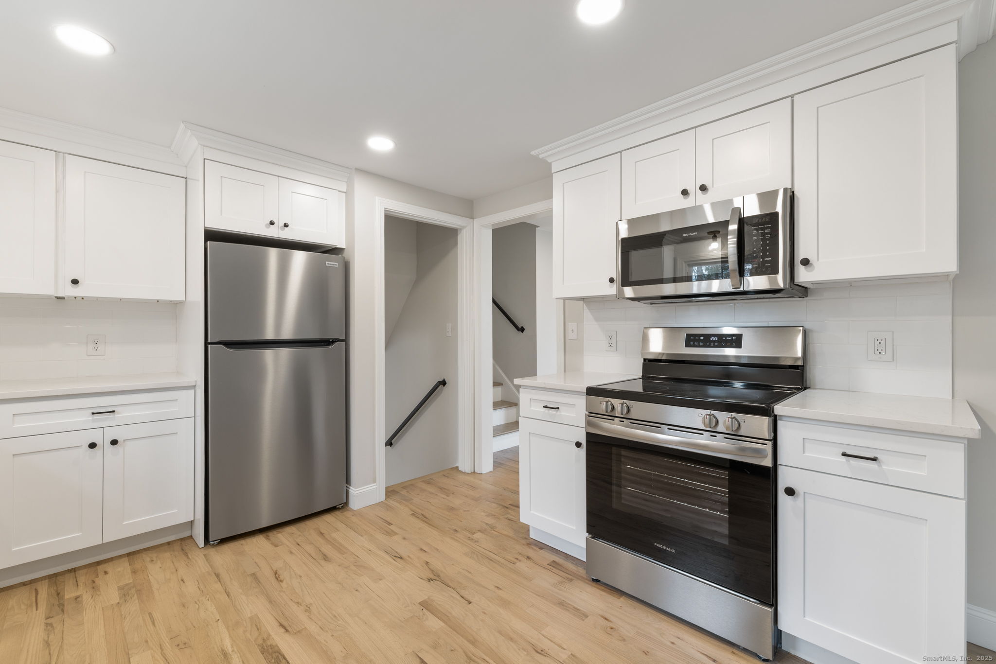 410 South Stone Street Suffield, CT 06093 - Photo 9 of 23 a kitchen with a refrigerator stove and microwave