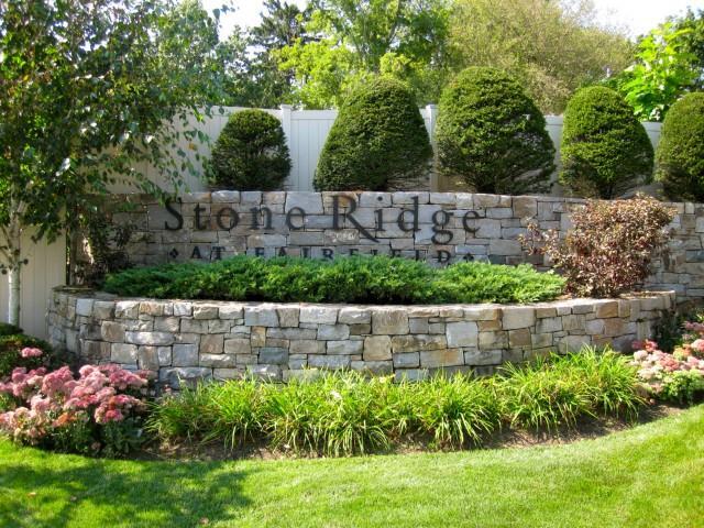 75 Stone Ridge Way Fairfield, CT 06824 - Photo 1 of 1 a wooden fence with some plants