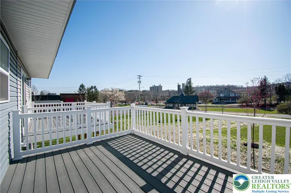 a view of balcony with wooden floor