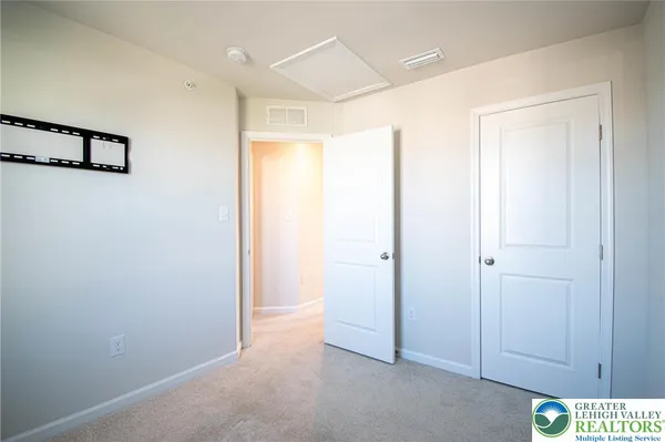 a view of a hallway with closet
