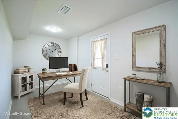 a workspace with furniture and window