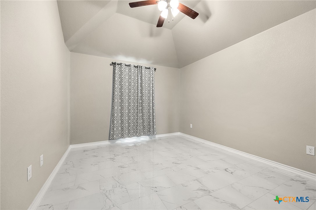 223 Sand Flat Lane Temple, TX 76502 - Photo 19 of 33 a view of an empty room with a chandelier fan