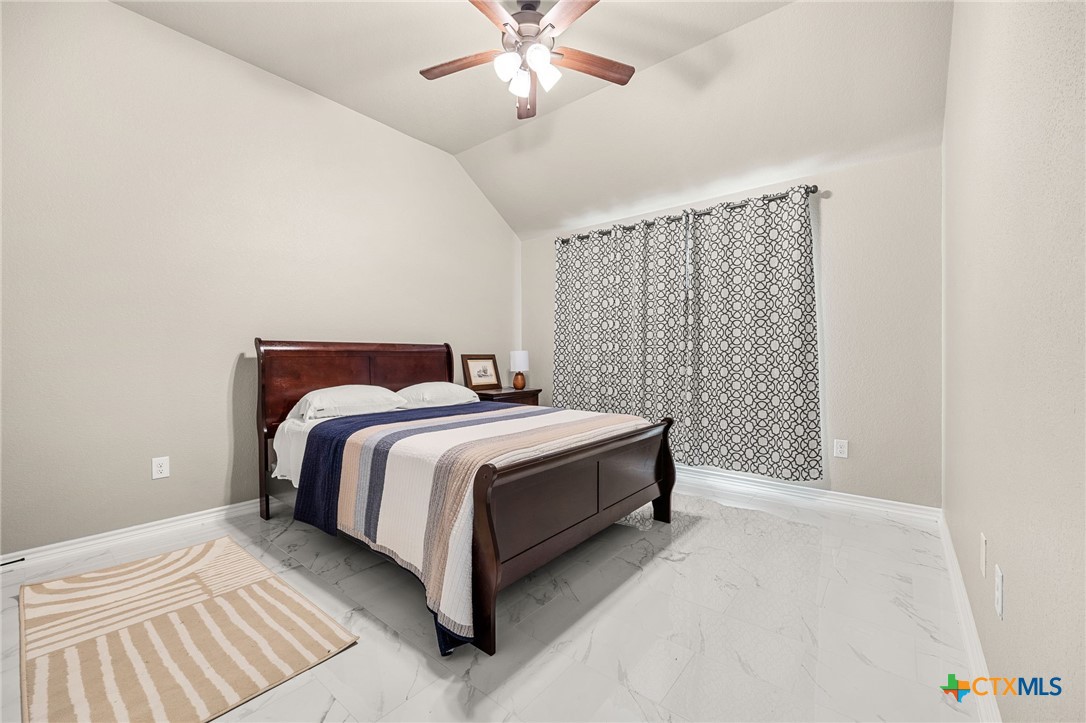 223 Sand Flat Lane Temple, TX 76502 - Photo 20 of 33 a bedroom with a bed and a ceiling fan