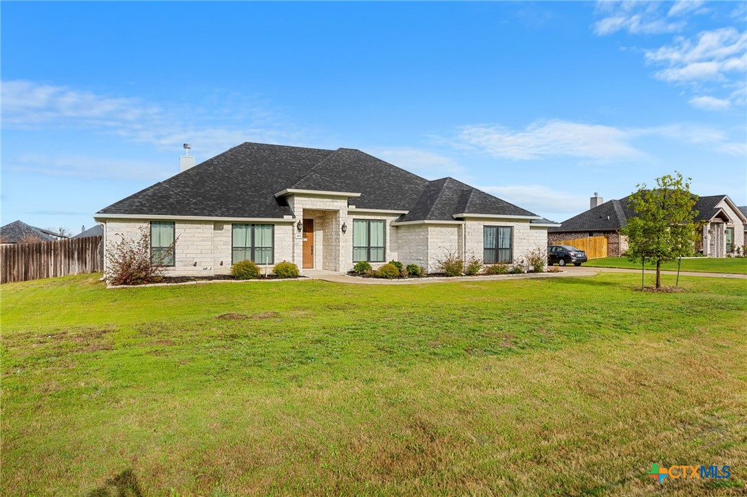 223 Sand Flat Lane Temple, TX 76502 - Photo 2 of 33 a front view of a house with a garden