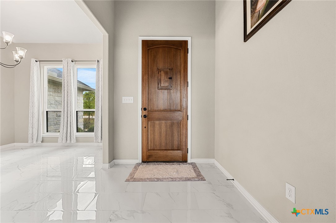223 Sand Flat Lane Temple, TX 76502 - Photo 4 of 33 a view of front door with a bench