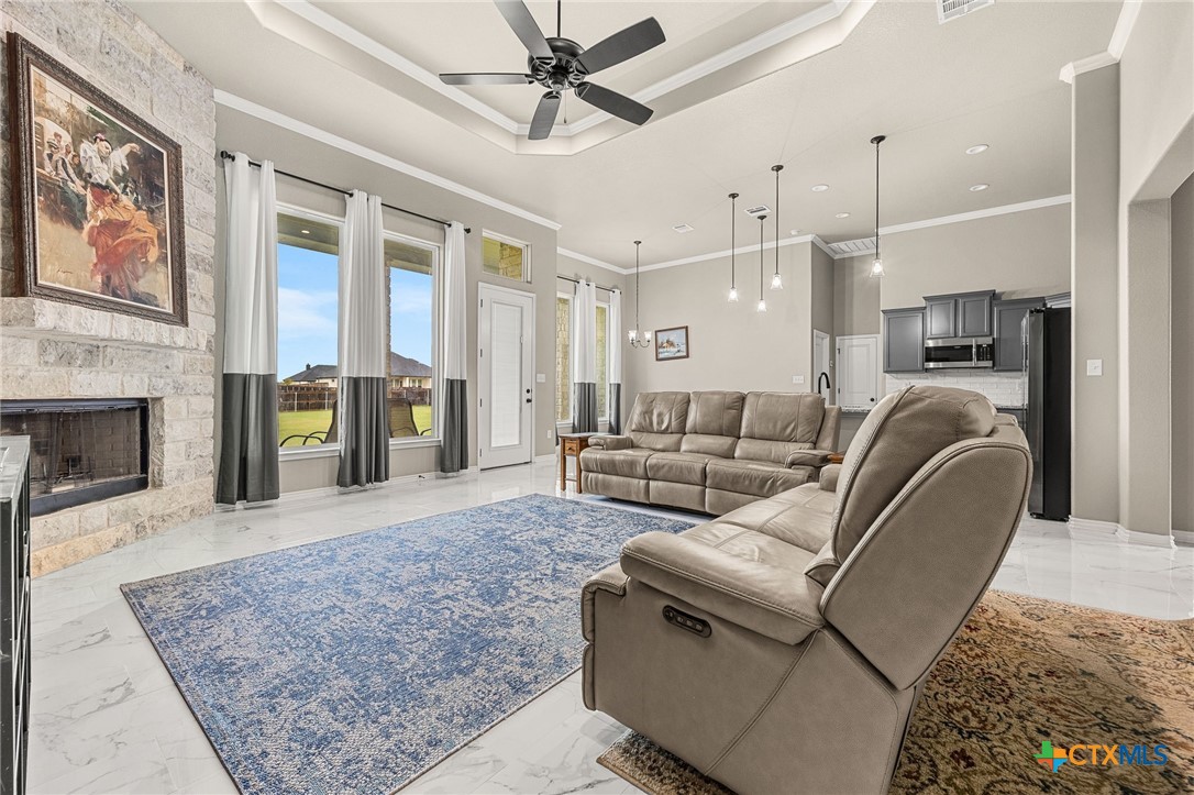 223 Sand Flat Lane Temple, TX 76502 - Photo 10 of 33 a living room with furniture and a fireplace