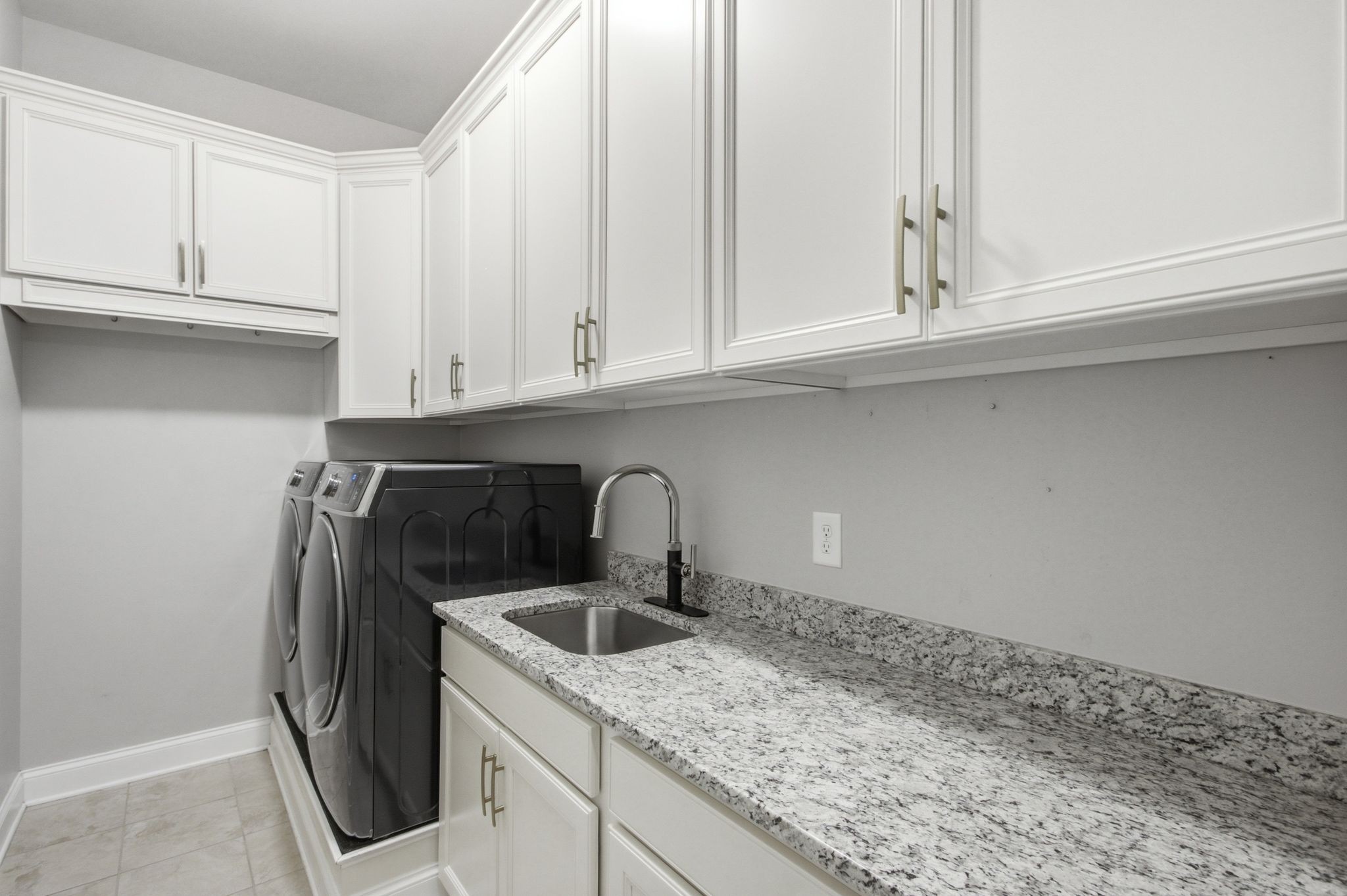 2720 Pool Forge Bridge Road Thompson's Station, TN 37179 - Photo 24 of 44 a kitchen with granite countertop white cabinets and sink
