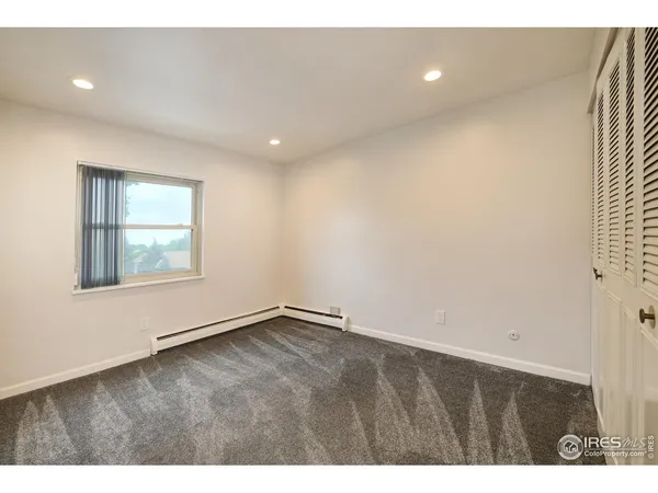 a view of an empty room with windows