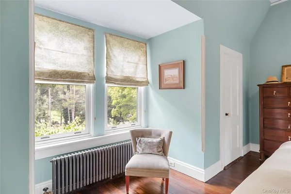 a view of a chair and window in a room