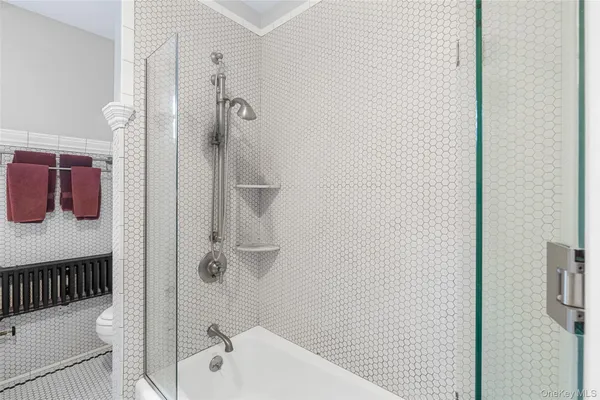 a bathroom with a bathtub and shower