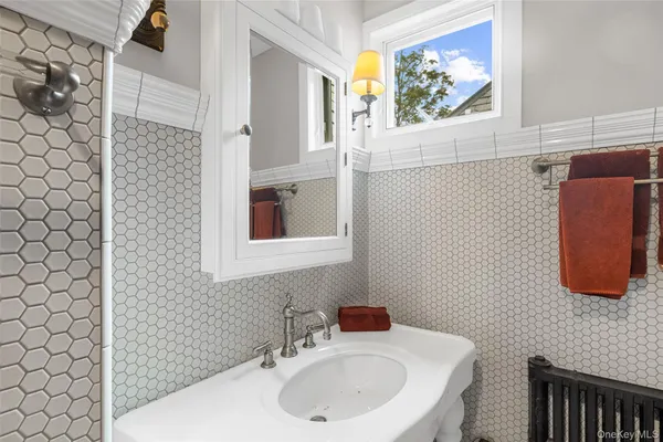 a bathroom with a sink and a mirror