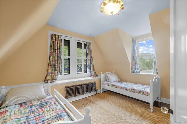 a bedroom with furniture and a window