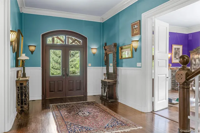 a view of an entryway with a grandfather clock