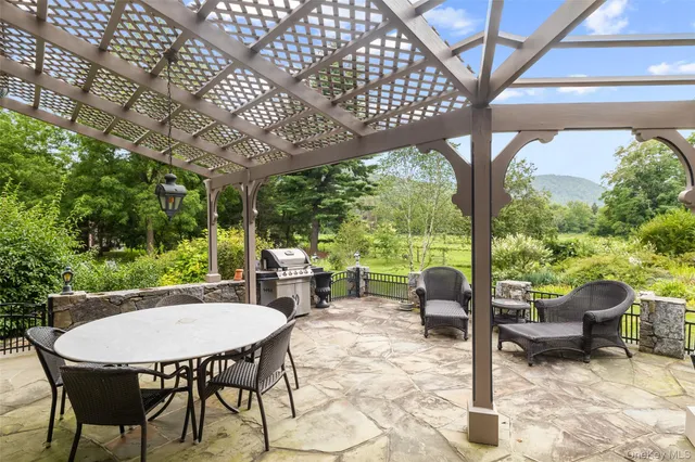 a view of a patio with a table chairs and a table