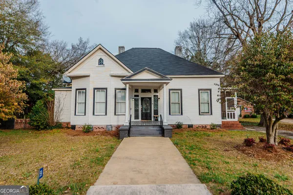 a front view of a house with a yard