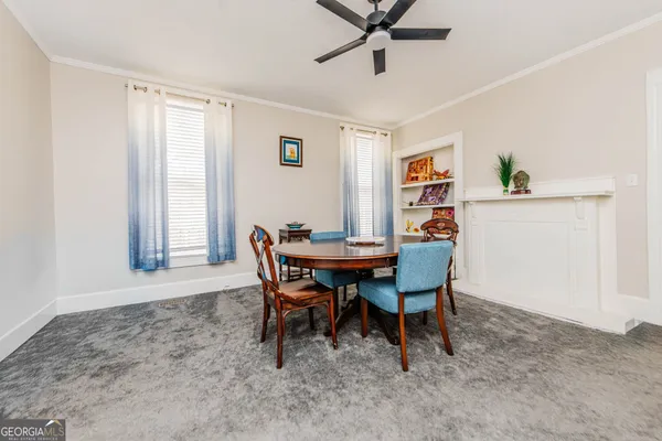 a view of a dining room with furniture