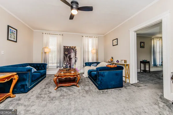 a living room with furniture and a window