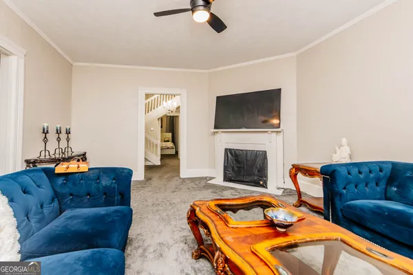 a bedroom with a bed and a television