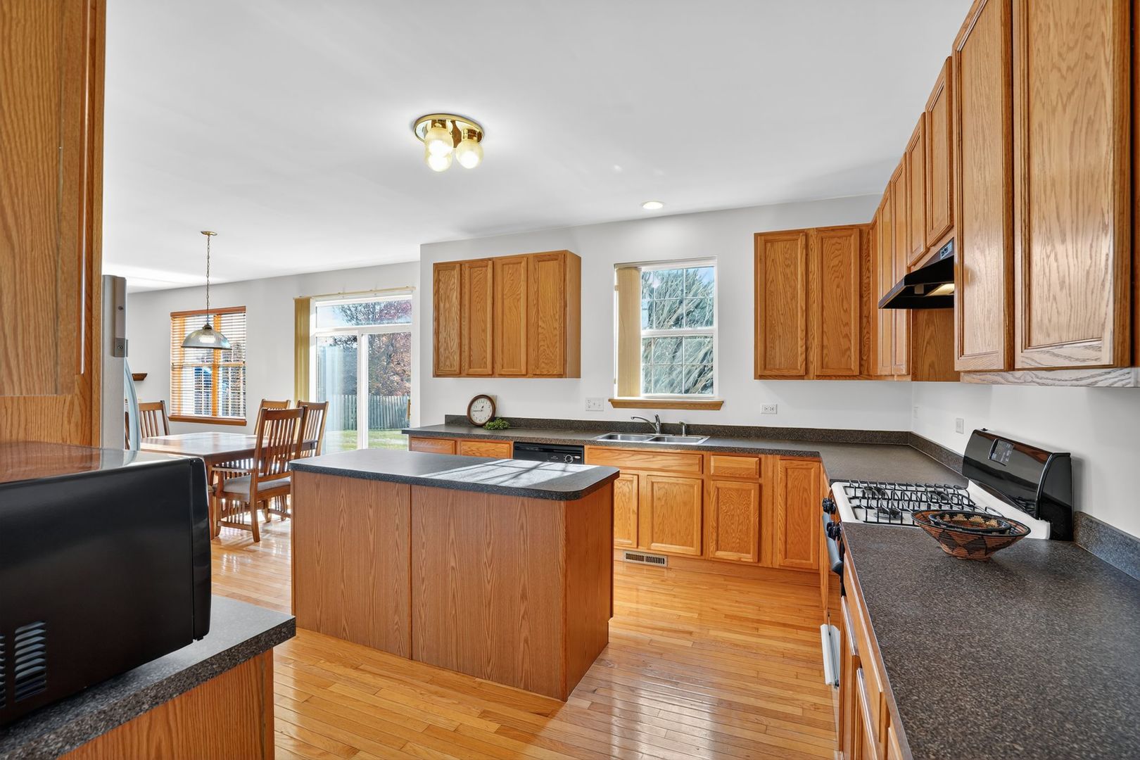 2722 Moraine Valley Road Wauconda, IL 60084 - Photo 12 of 42 a kitchen with stainless steel appliances granite countertop a sink stove and cabinets