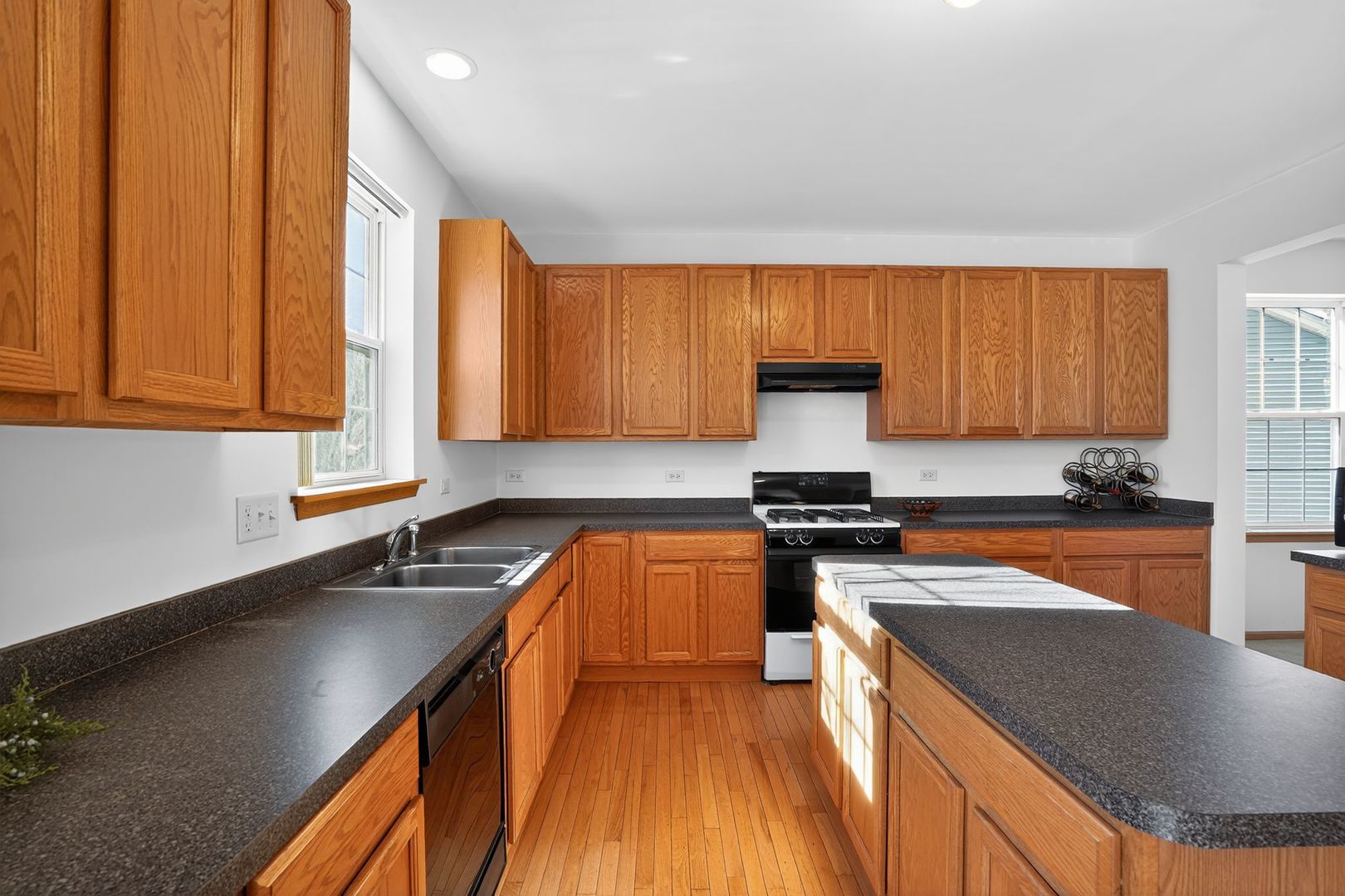 2722 Moraine Valley Road Wauconda, IL 60084 - Photo 16 of 42 a kitchen with stainless steel appliances granite countertop a sink stove and refrigerator