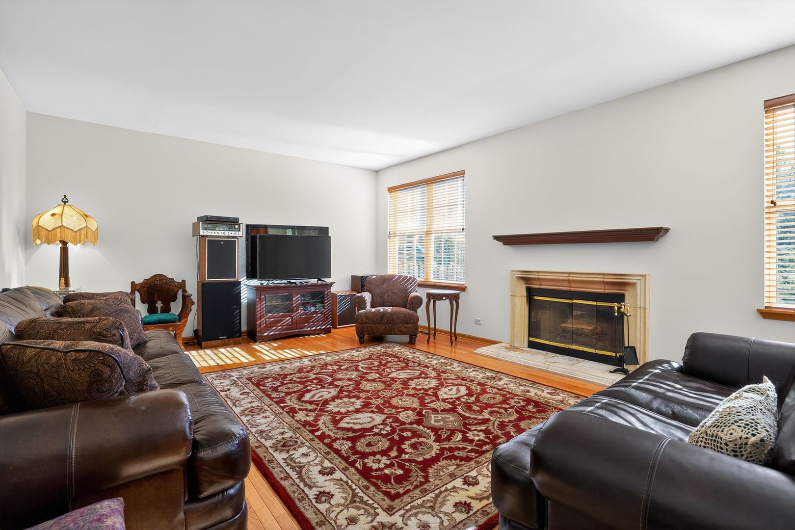 2722 Moraine Valley Road Wauconda, IL 60084 - Photo 21 of 42 a living room with furniture and a fireplace