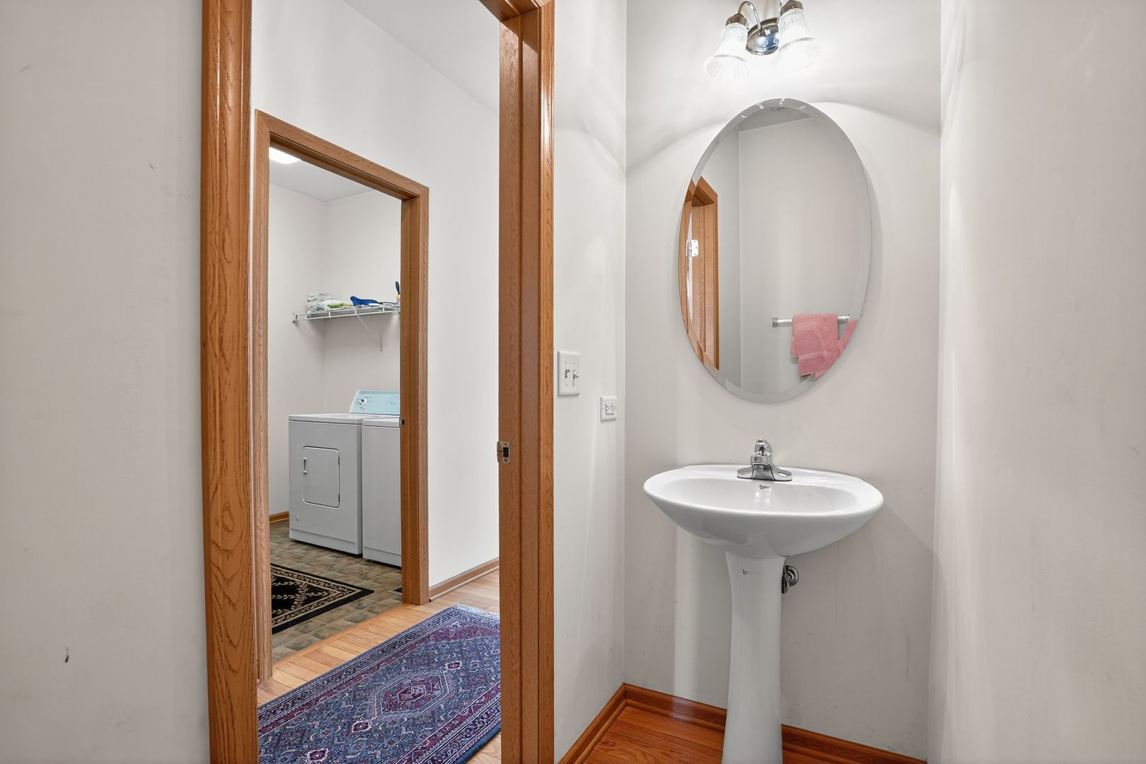 2722 Moraine Valley Road Wauconda, IL 60084 - Photo 23 of 42 a bathroom with a sink and a mirror