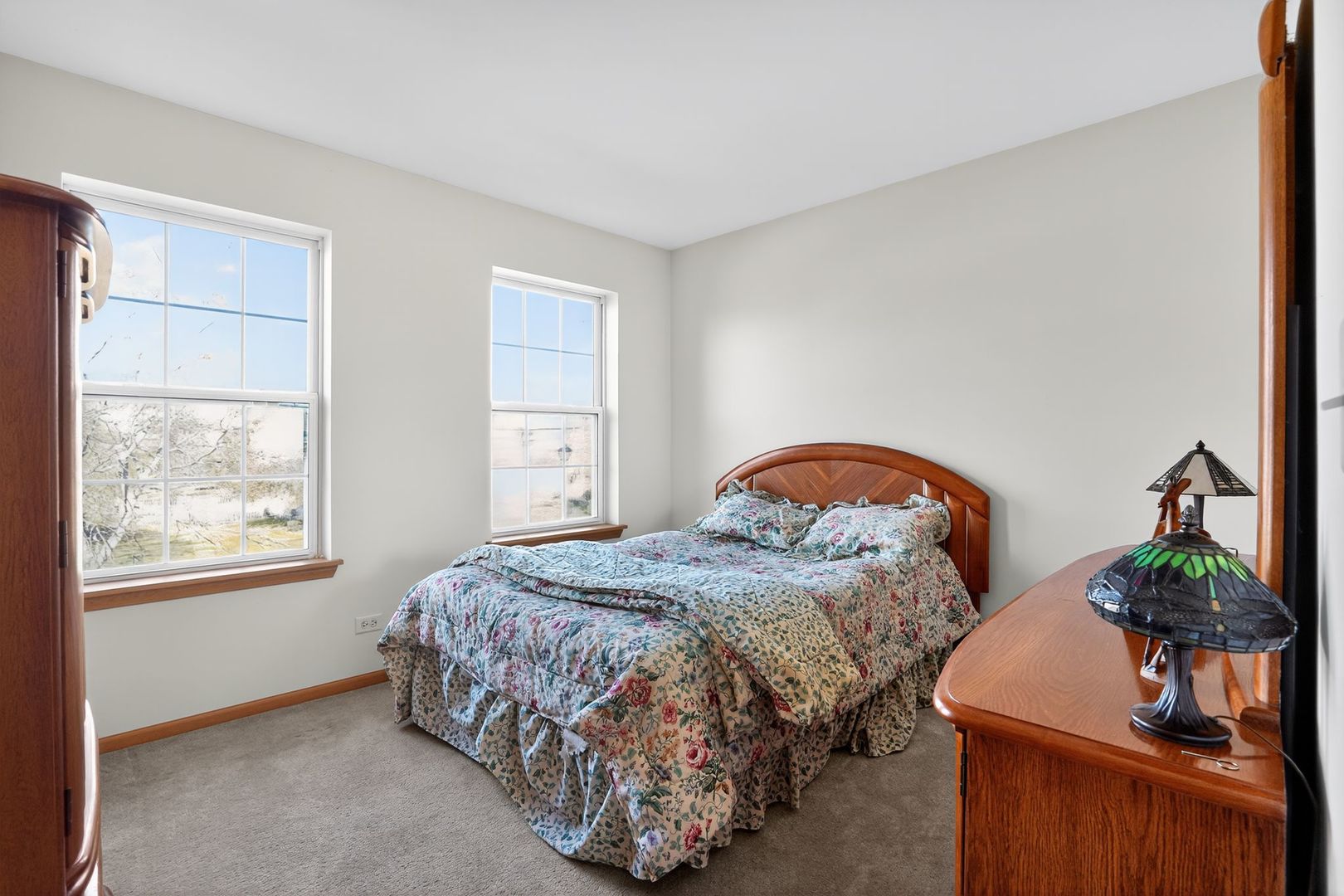 2722 Moraine Valley Road Wauconda, IL 60084 - Photo 33 of 42 a bedroom with a bed potted plant on dresser and a window
