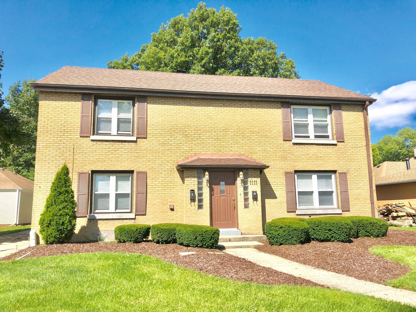 a front view of a house with a yard
