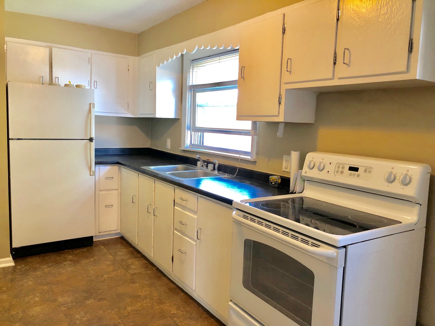 1111 Lincoln Street, Unit 2 Lockport, IL 60441 - Photo 2 of 13 a kitchen with granite countertop white cabinets and white appliances