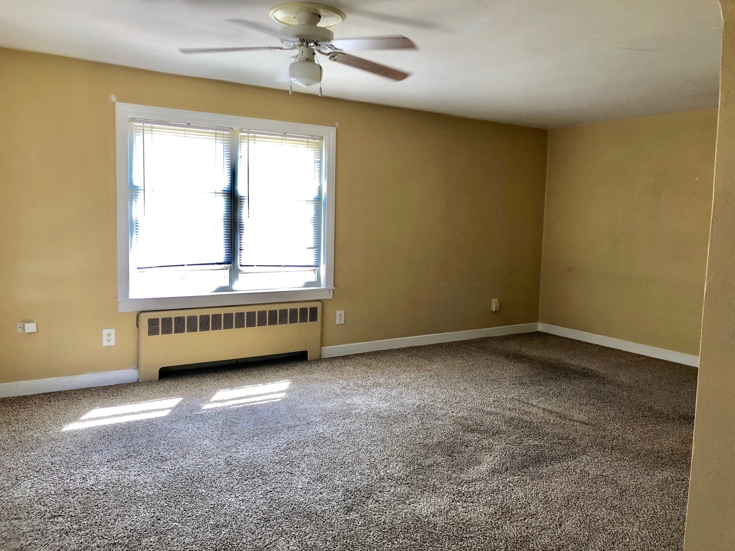1111 Lincoln Street, Unit 2 Lockport, IL 60441 - Photo 4 of 13 a view of an empty room with a window