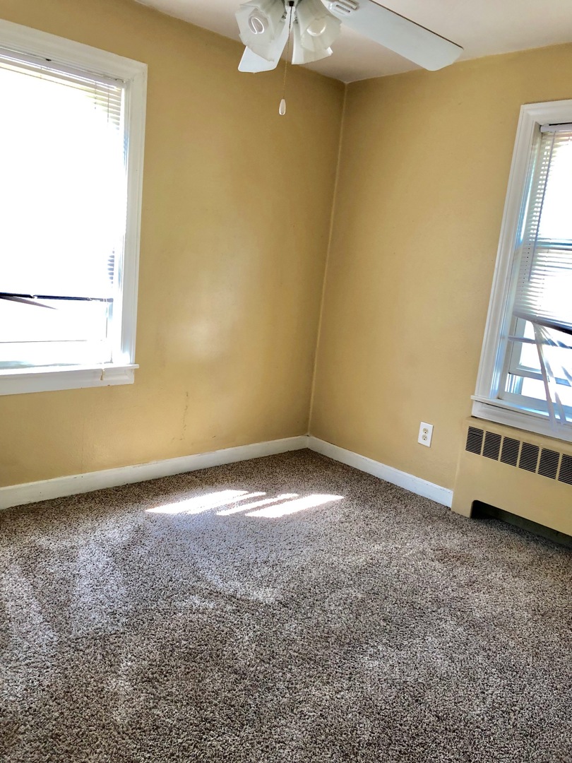 1111 Lincoln Street, Unit 2 Lockport, IL 60441 - Photo 9 of 13 an empty room with a window